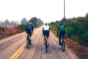 Three male cyclists riding one of the Eroica California routes