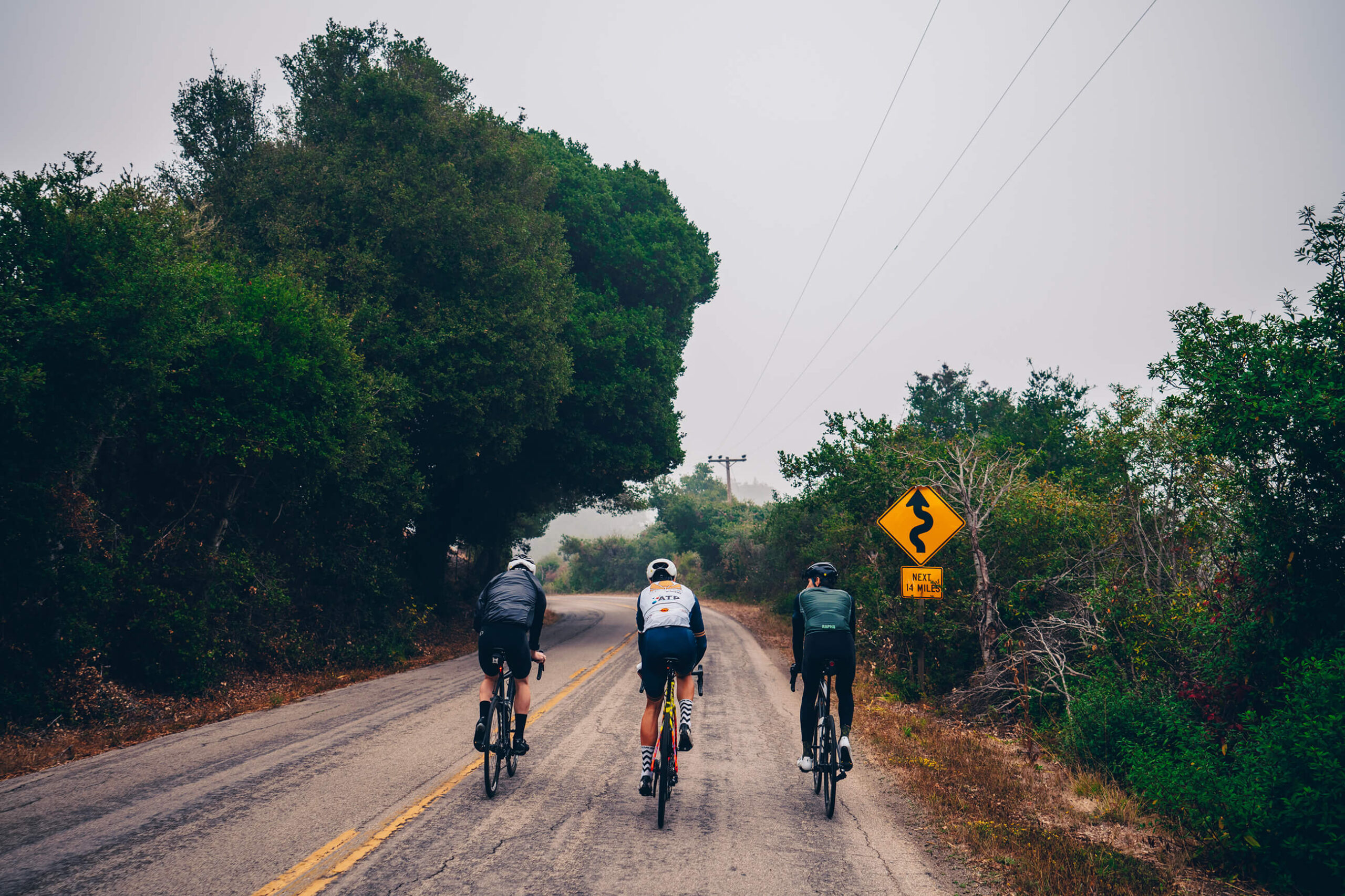 Three cyclists riding on Santa Rita Road on the Central Coast